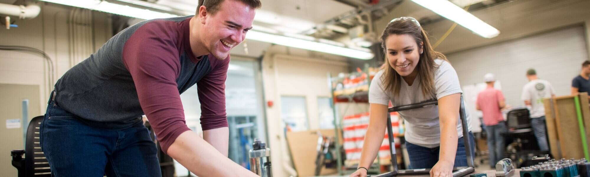 Engineering students connecting materials
